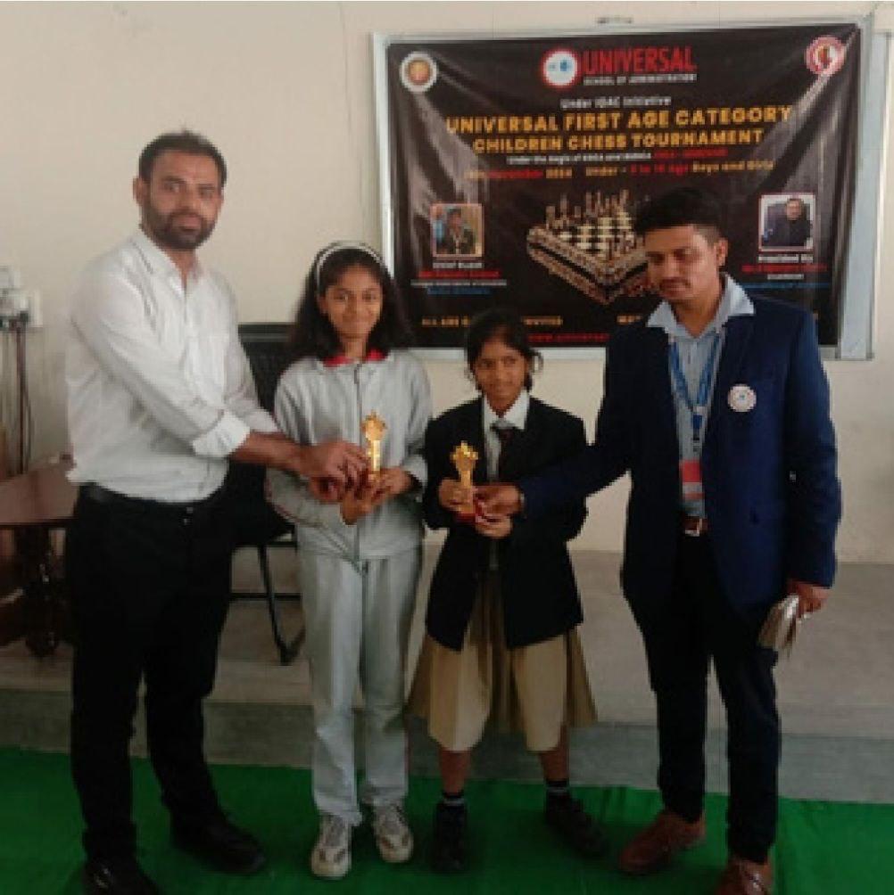 OMCA students receiving trophies at a chess tournament