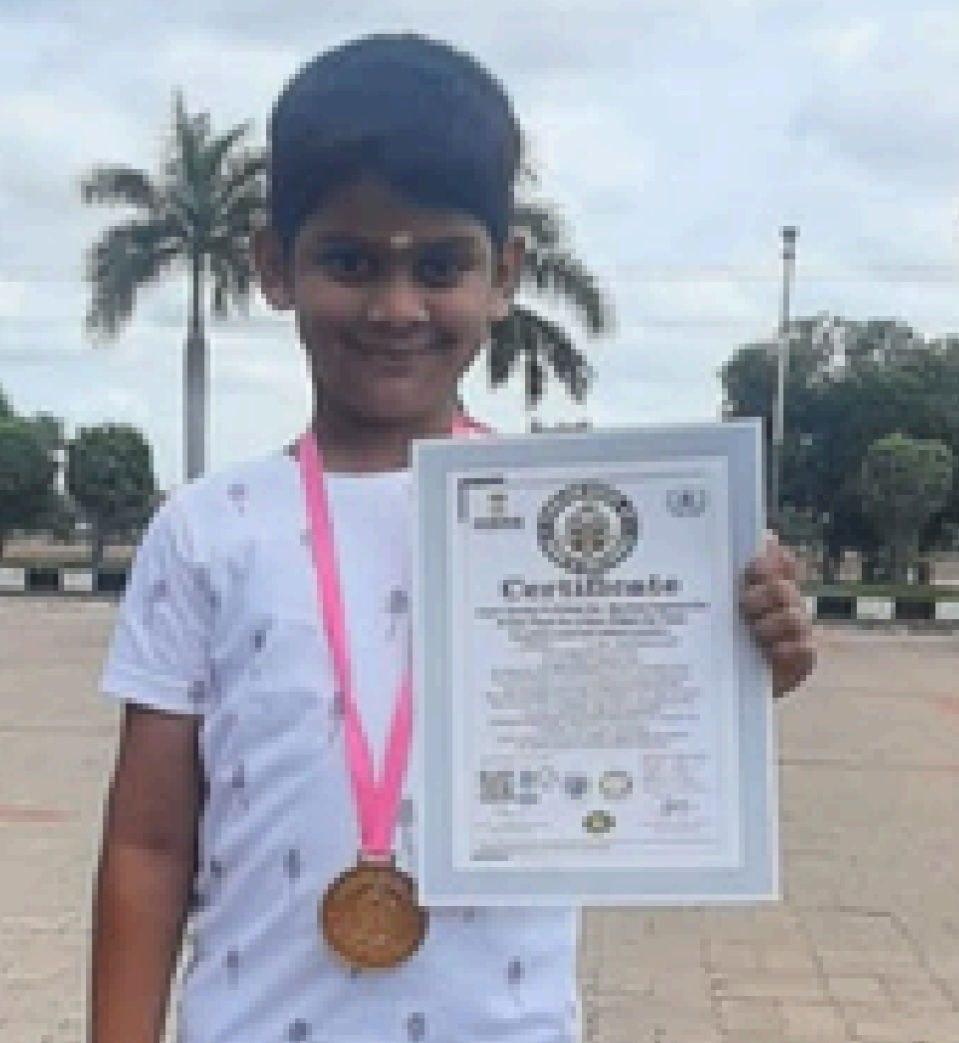 OMCA student with a chess competition certificate and medal