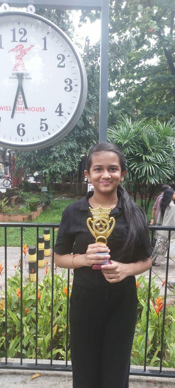 OMCA student with a chess trophy